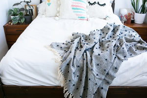 Blue decorative throw blanket with details