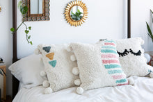 Load image into Gallery viewer, Washable pillow with eyelashes in cream and oink, teal and green accent colors 
