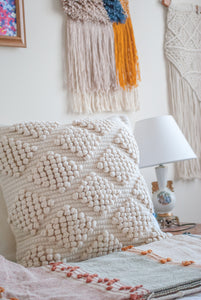 Beige textured throw pillow