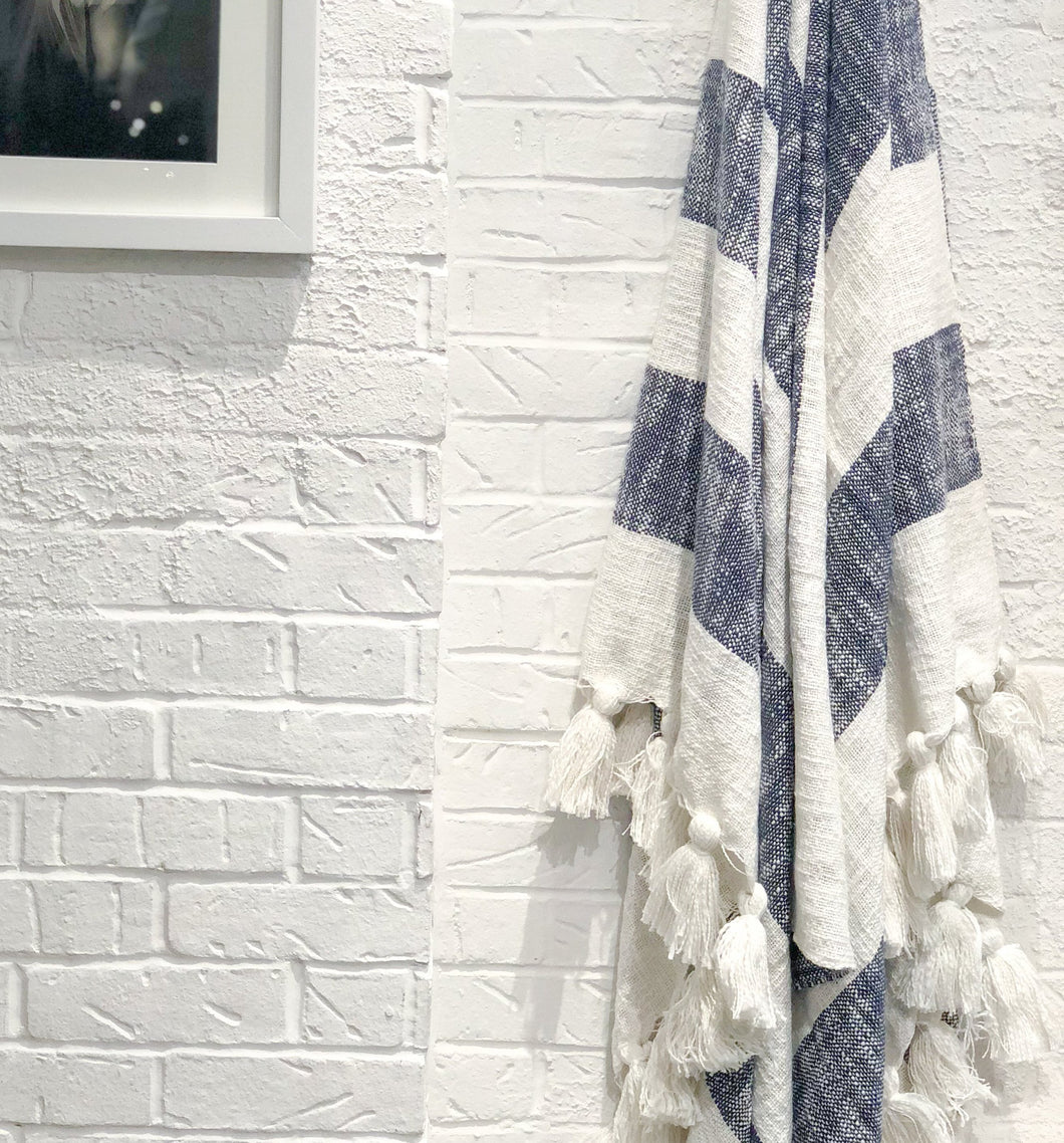 Designer striped throw in navy blue with tassels
